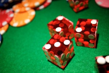 Live dealer at okejp Three Card Poker table with cards dealt and professional studio setup